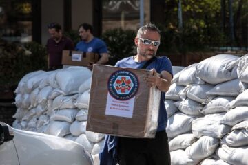Luca Alfatti with supplies. Photography credit: Perou. Images supplied courtesy of World Extreme Medicine.