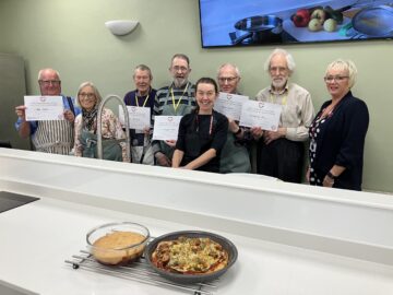 Westbank Community Health and Care with Community Services' Manager, Nikki Bromley (centre) and CEO Sarah Hicks (right) and a Westbank volunteer (second from left) with the first cohort of newbie cooks. Image by Andra Patriche Photography.