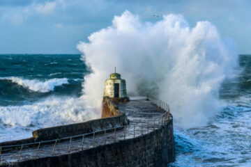 The power of waves: A Cornish Harbour confronts gale force winds and swollen seas. Image: James Pearce / Shutterstock.