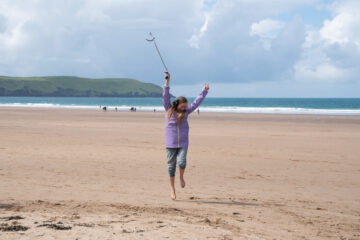 Making it safer for marine life: A silent disco beach clean at Woolacombe, Devon. Copyright: National Trust Images / Sophie Bolesworth.