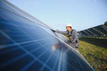 An engineer works on a solar farm. Image: Hryshchyshen Serhii / Shutterstock.