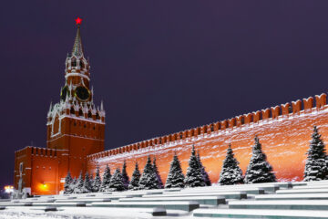 Snow covering Red Square in Moscow. The image shows the Spasskaya Tower and the Kremlin wall. Image: Mikhail Semenov / Shutterstock.