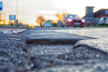 The RAC recently released data which shows a substantial increase in patrols attending vehicles damaged by potholes. Image: David Michael Bellis / Shutterstock.