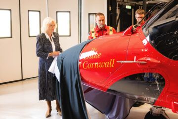Left to Right: Her Majesty The Queen, Cornwall Air Ambulance's Steve Garvey, Air Operations Officer and Dave Ashton-Cleary, Lead Airbase Doctor. Image: Andy Holter Photography.