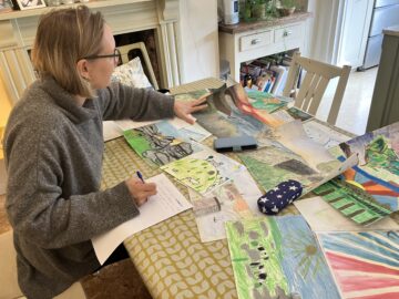 Artist Kath Hadden judging entries for the 2025 Devon CPRE Young Artist of the Year competition.