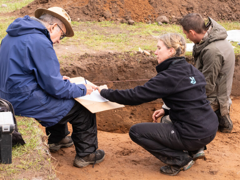 Participants completing a section drawing with the help of a National Trust archaeologist, Janine Young. Image: Jayne Gough, National Trust.