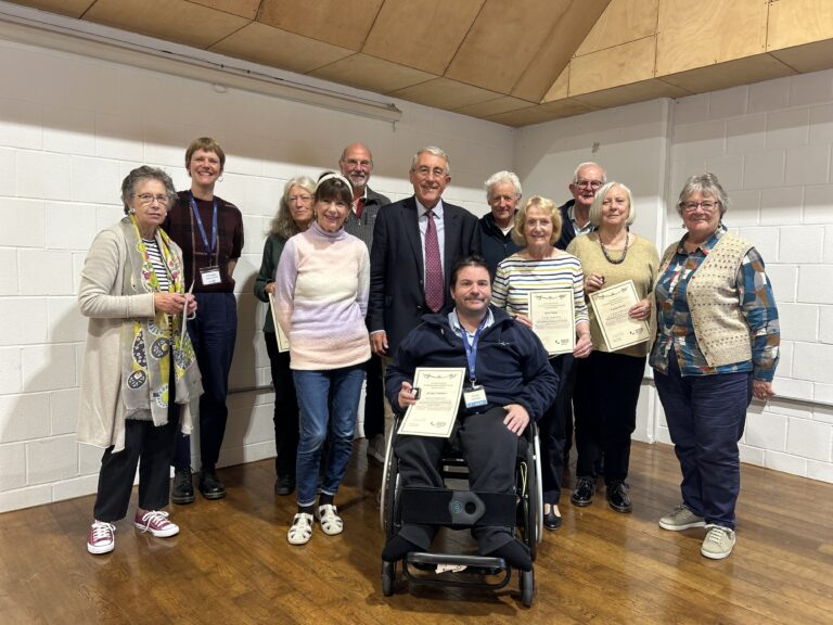 Patrick Newberry with National Maritime Museum Cornwall volunteers. Image: NMMC.