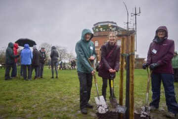 The Tree of Hope being planted by volunteers from Greener Greenham: Helen Beard, Catherine Prior and Alison Blackborow. Image: Trevor Ray Hart / National Trust Images.