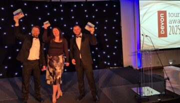 Kents Cavern celebrates success at both the regional Devon Tourism Awards and the national Group Travel World Awards. From left to right: James Hull, (former) General Manager; Chloe Porter, F&B Manager and Elliot Ling, Operations Manager.