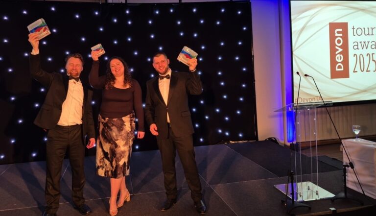 Kents Cavern celebrates success at both the regional Devon Tourism Awards and the national Group Travel World Awards. From left to right: James Hull, (former) General Manager; Chloe Porter, F&B Manager and Elliot Ling, Operations Manager.