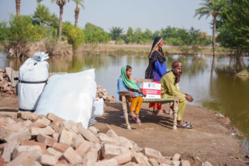 A family supported by ShelterBox and Islamic Relief Pakistan after severe flooding in Pakistan. Image provided by ShelterBox.