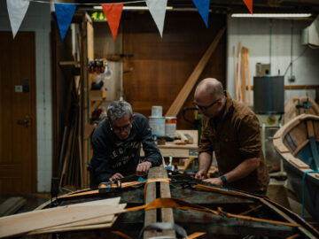 Bob White (left), Boat Collection Manager at National Maritime Museum Cornwall with Wyl Menmuir (right). Image provided by Katie Wild Content.